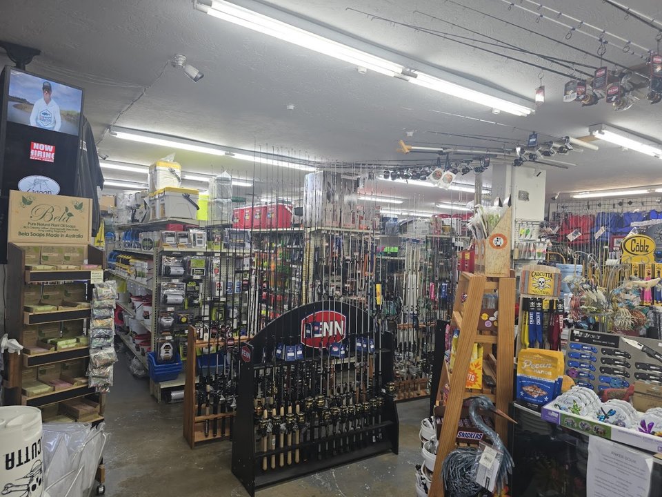 Hardware aisles with fishing tackle and bait supplies.